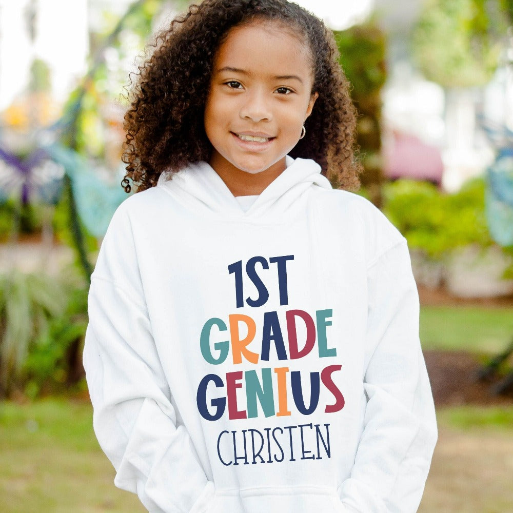 Customize this first grade, back to school sweatshirt gift idea for your genius. For first day of school, school field trips, 100 days of school, graduation or a new grade. Perfect name shirt outfit for everyday use in or out of classroom. 1st grade hoodie.