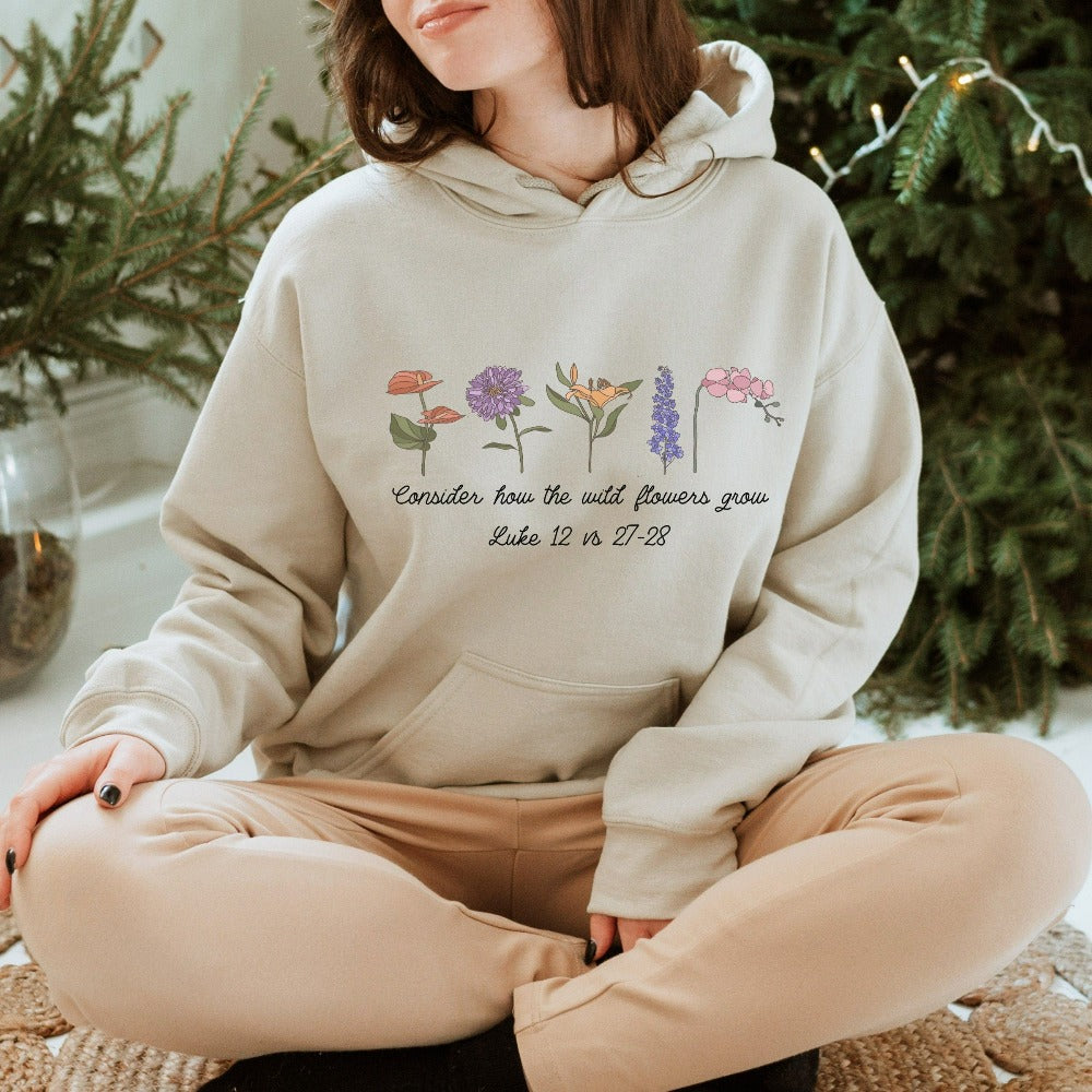 Floral Christian wildflower sweatshirt. This bible verse quote from Luke 12: 27 - 28 is a supportive, uplifting and positive saying and makes this shirt a perfect gift idea for everyone. Perfect outfit for family reunion, friend's birthday, youth pastor, service leader, Sunday school camping, Mother's Day, Christmas holiday, Thanksgiving and more. The botanical wild flower design gives this religious apparel a relaxed cottage core boho look.