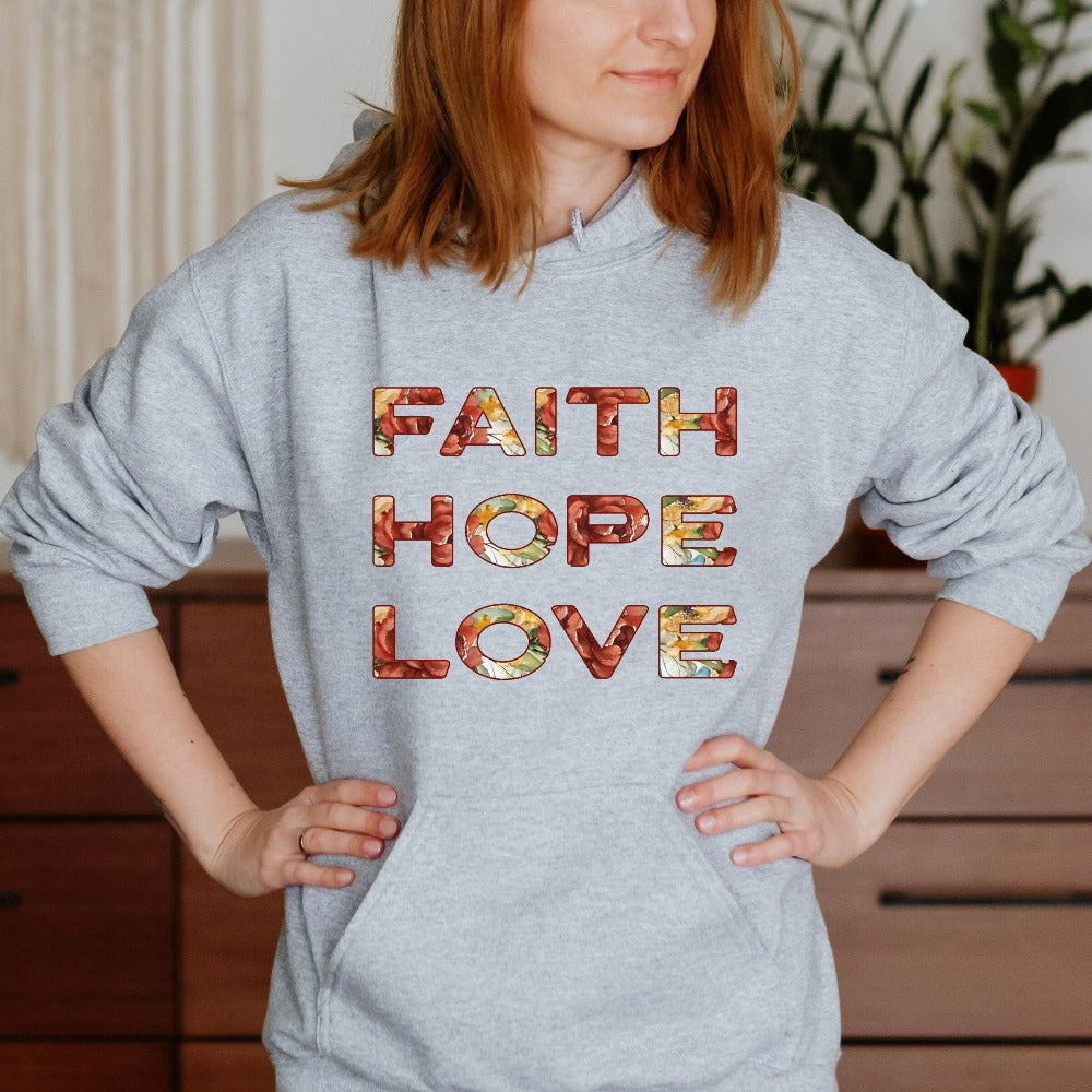 Positive Christian faith based gift idea outfit for religious friend or loved one. Bible verse and 1st Corinthians 13 quote - Faith, Hope and Love saying. Great matching floral sweatshirt for a church convention, Sunday school or weekend service. Grab this for a birthday shirt for youth pastor or leader, minister or any other Christian family.