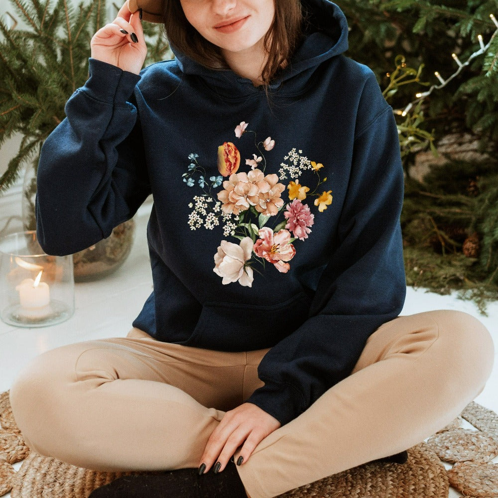 Bright, beautiful, simple and elegant. This adorable boho botanical floral sweatshirt is a favorite. With wild flowers and cottage core vibes, it is perfect for any nature lover, plant lover or really anyone that appreciates the outdoors. The watercolor flower arrangement in pastel colors makes this graphic hoodie unique and beautiful. Perfect gift idea for birthday, Christmas holiday, Mother's Day, Thanksgiving or anniversary.