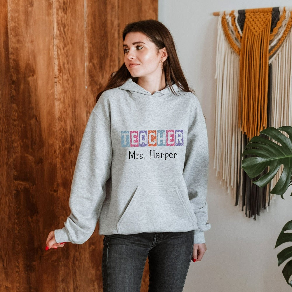 Custom name sweatshirt gift idea for teacher, trainer, instructor and homeschool mama. Show appreciation to your favorite grade teacher with this vibrant trendy shirt. Perfect for elementary, middle or high school, back to school, last day of school, summer or spring break. Great for everyday use both in and out of the classroom.