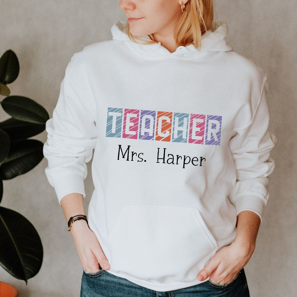 Custom name sweatshirt gift idea for teacher, trainer, instructor and homeschool mama. Show appreciation to your favorite grade teacher with this vibrant trendy shirt. Perfect for elementary, middle or high school, back to school, last day of school, summer or spring break. Great for everyday use both in and out of the classroom.