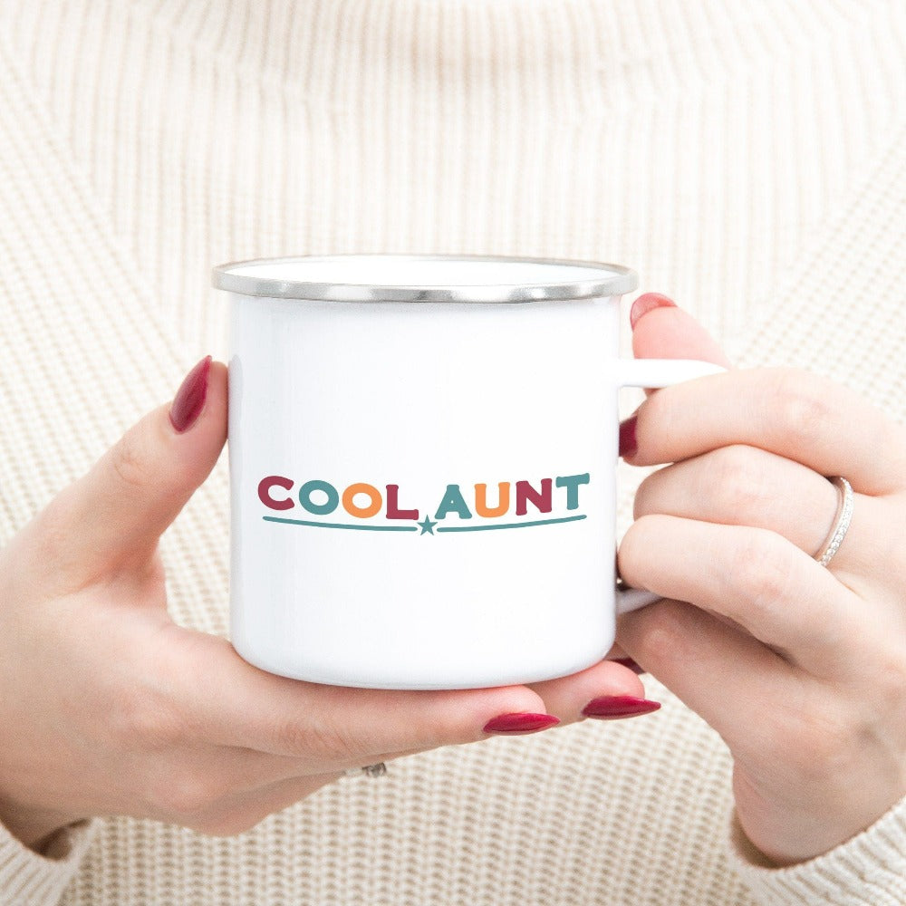Celebrate the best Cool Aunt ever with this colorful auntie coffee mug. Whether it's for a family reunion, weekend visit, birthday or Christmas holidays, this adorable beverage cup is a thoughtful gift idea for your aunt. Makes a great memorable present from niece or nephew on her special day. This cute souvenir for aunty is a great idea for a promoted to aunt pregnancy reveal or new baby announcement surprise for your sister, family, sibling or best friend as the newest favorite funtie tia!