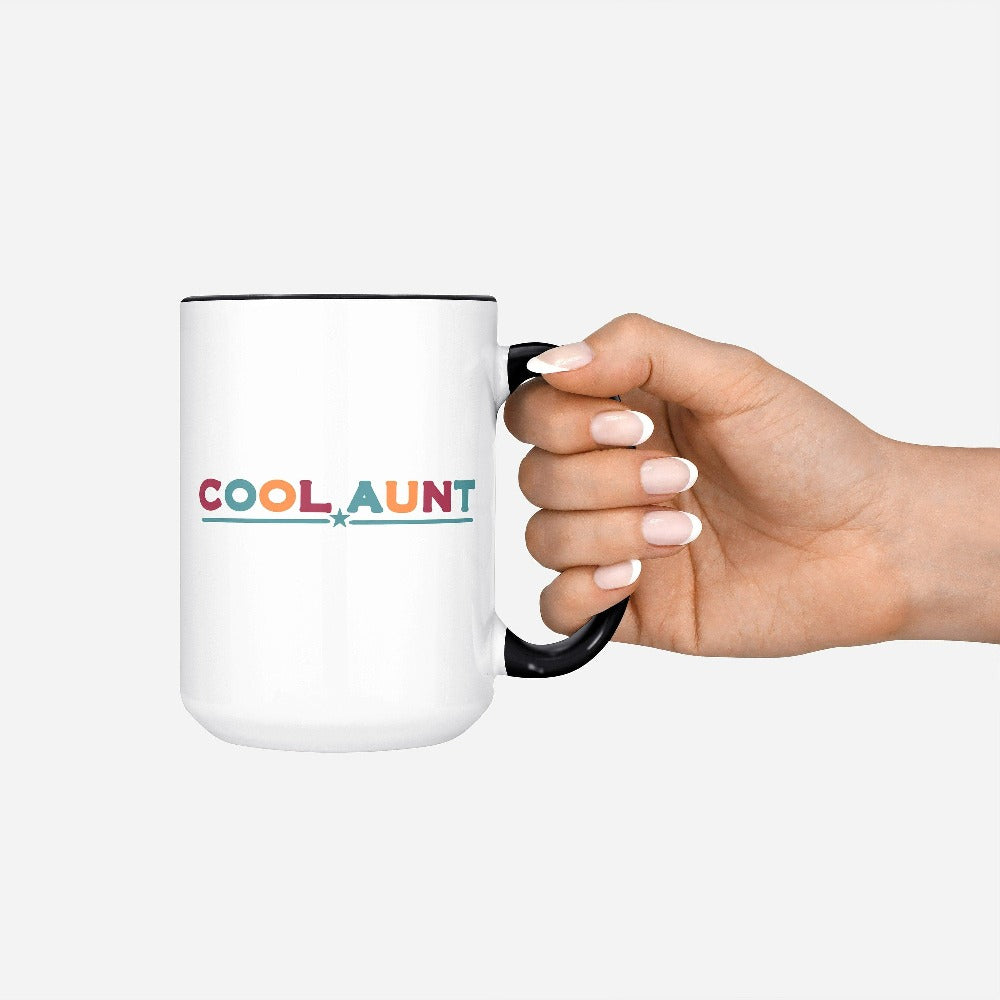 Celebrate the best Cool Aunt ever with this colorful auntie coffee mug. Whether it's for a family reunion, weekend visit, birthday or Christmas holidays, this adorable beverage cup is a thoughtful gift idea for your aunt. Makes a great memorable present from niece or nephew on her special day. This cute souvenir for aunty is a great idea for a promoted to aunt pregnancy reveal or new baby announcement surprise for your sister, family, sibling or best friend as the newest favorite funtie tia!