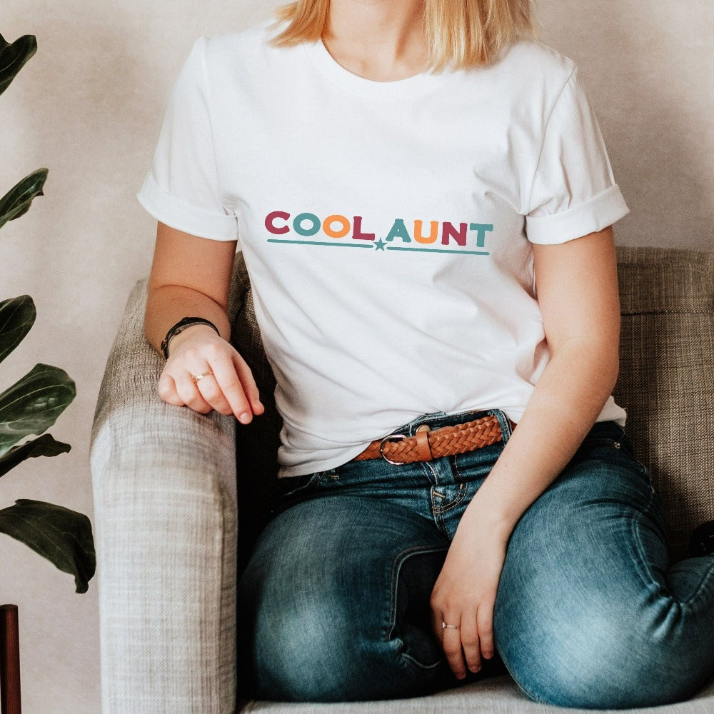 Celebrate the best Cool Aunt ever with this colorful auntie shirt. Whether it's for a family reunion, weekend visit, birthday or Christmas holidays, this adorable top is a thoughtful gift idea for your aunt. Makes a great memorable present from niece or nephew on her special day. This cute uplifting casual tee outfit for aunty is a great idea for a promoted to aunt pregnancy reveal or new baby announcement surprise for your sister, family, sibling or best friend as the newest favorite funtie tia!
