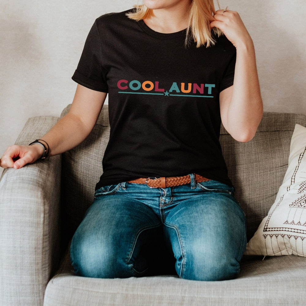 Celebrate the best Cool Aunt ever with this colorful auntie shirt. Whether it's for a family reunion, weekend visit, birthday or Christmas holidays, this adorable top is a thoughtful gift idea for your aunt. Makes a great memorable present from niece or nephew on her special day. This cute uplifting casual tee outfit for aunty is a great idea for a promoted to aunt pregnancy reveal or new baby announcement surprise for your sister, family, sibling or best friend as the newest favorite funtie tia!