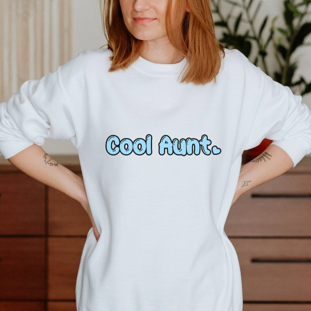 Show love and appreciation with this Cool Aunt sweatshirt for the best auntie. Whether it's for a family reunion, weekend visit, birthday or Christmas holidays, this adorable top is a thoughtful gift idea for your aunt. Makes a great memorable present from niece or nephew on her special day. This cute uplifting outfit for aunty is a great idea for a pregnancy reveal or new baby announcement surprise to your sister, family, sibling or best friend as the newest favorite funtie tia!