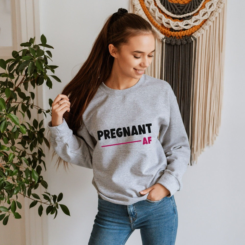 Cute pregnant AF sweatshirt. Celebrate your little blessing with this perfect going home hospital outfit for new mom. Great family surprise baby announcement shirt for mother of multiples, expecting mother, gender reveal party. IVF baby shower gift idea.