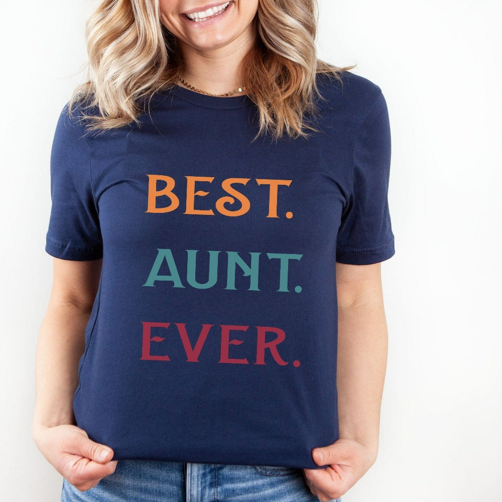 Celebrate the Best Aunt Ever with this colorful auntie shirt. Whether it's for a family reunion, weekend visit, birthday or Christmas holidays, this adorable top is a thoughtful gift idea for your aunt. Makes a great memorable present from niece or nephew on her special day. This cute uplifting casual tee outfit for aunty is a great idea for a promoted to aunt pregnancy reveal or a new baby announcement surprise for your sister, family, sibling or best friend as the newest favorite funtie tia!