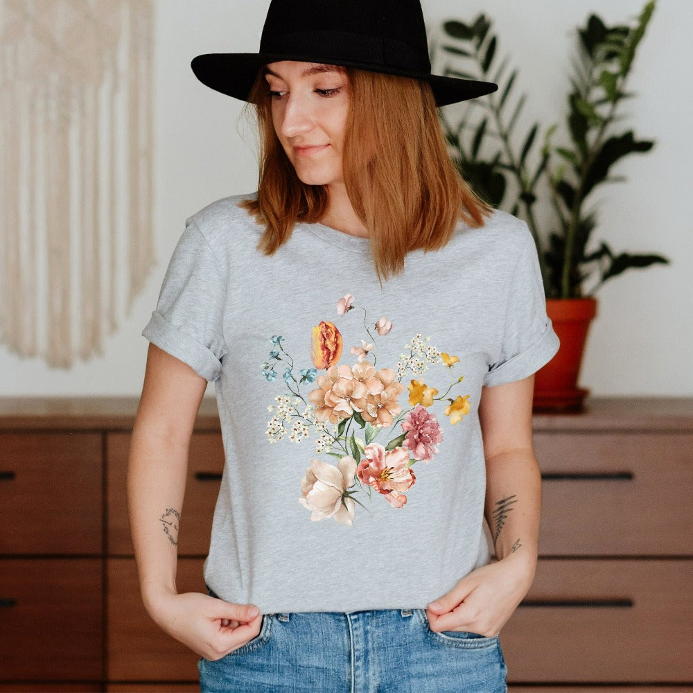Bright, beautiful, simple and elegant. This adorable boho botanical floral shirt is a favorite. With wild flowers and cottage core vibes, it is perfect for any nature lover, plant lover or really anyone that appreciates the outdoors. The watercolor flower arrangement in pastel colors makes this graphic tee unique and beautiful. Perfect gift idea for birthday, Christmas holiday, Mother's Day, Thanksgiving or anniversary.