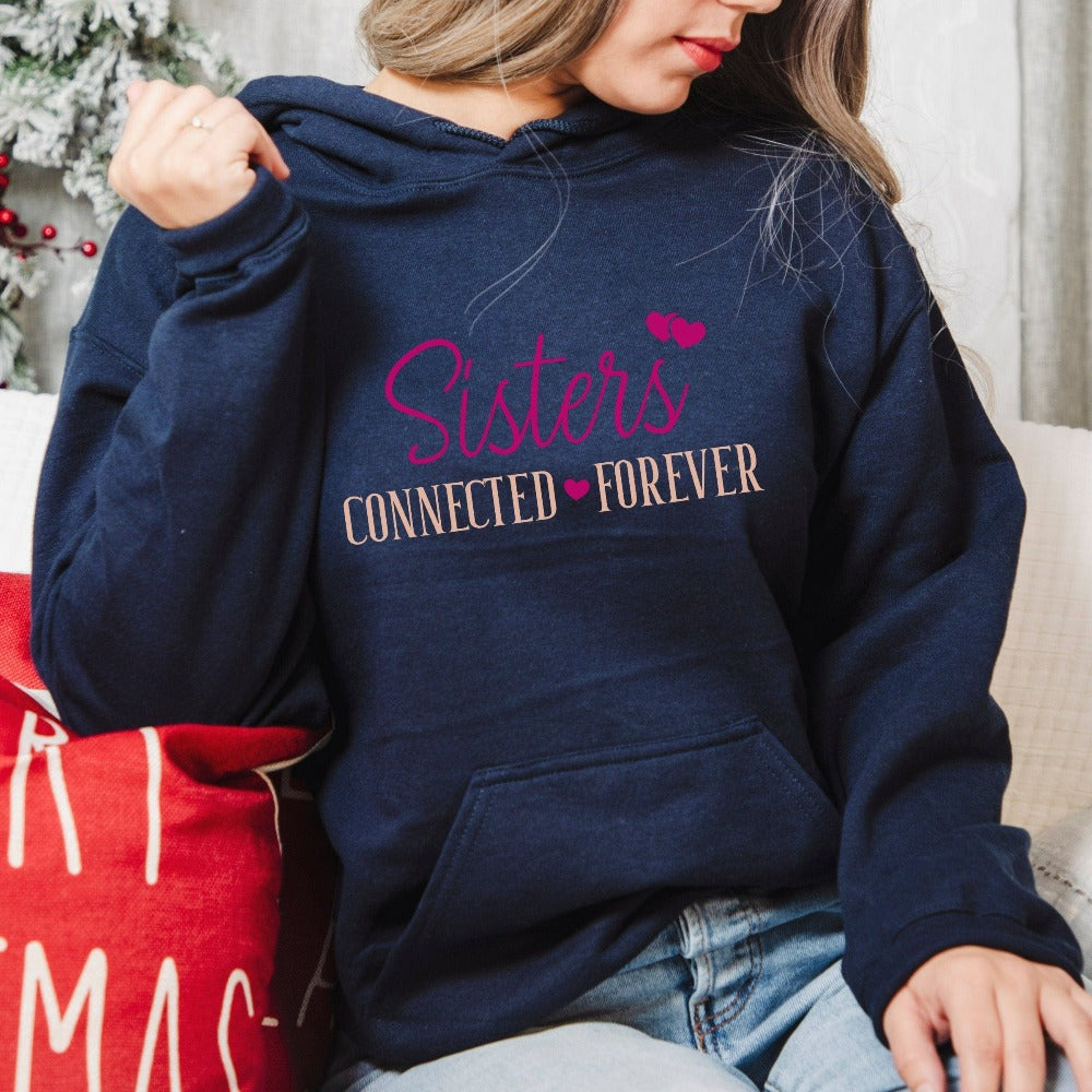 Adorable connected sisters' matching sweatshirt gift idea. Whether she is a long distance away or close by, celebrate your sister by birth, sorority, chance or circumstance with this lovely matching outfit for your loved one or twin. Cute casual hoodie for cruise vacations, family camping reunion, birthdays, Christmas holiday, Thanksgiving visit, girls road trip or airport travel. 