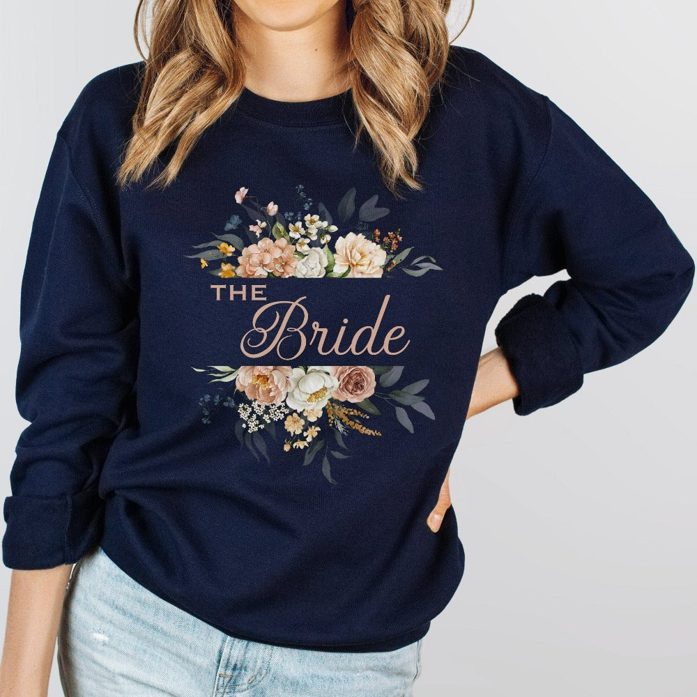 This floral bride sweatshirt is a dream and a great addition while getting ready for your wedding day. Works as an engagement announcement surprise shirt, bachelorette party outfit, gift from bridesmaid or maid of honor, rehearsal night dinner outfit and errand top for your wedding planning activities. So, if you have a soon to be bride, future Mrs. friend, or future daughter-in-law, this sweatshirt is a great gift idea for her.