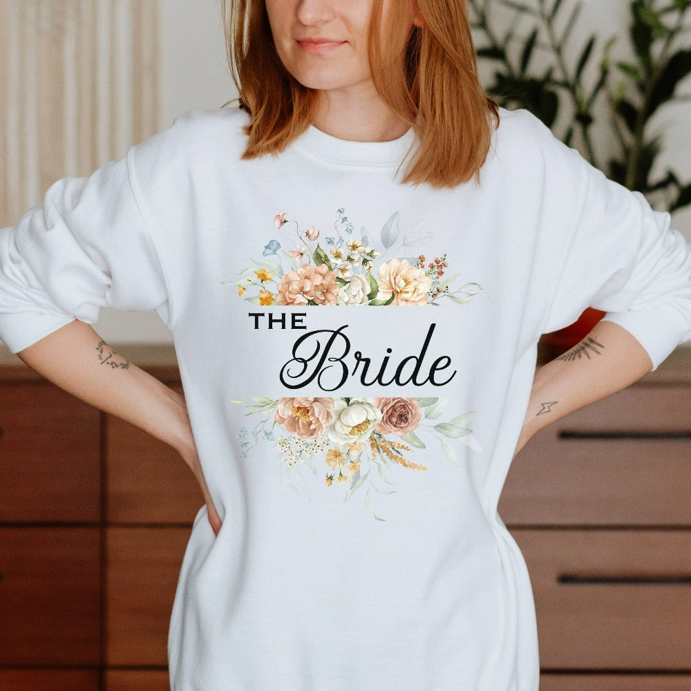 This floral bride sweatshirt is a dream and a great addition while getting ready for your wedding day. Works as an engagement announcement surprise shirt, bachelorette party outfit, gift from bridesmaid or maid of honor, rehearsal night dinner outfit and errand top for your wedding planning activities. So, if you have a soon to be bride, future Mrs. friend, or future daughter-in-law, this sweatshirt is a great gift idea for her.