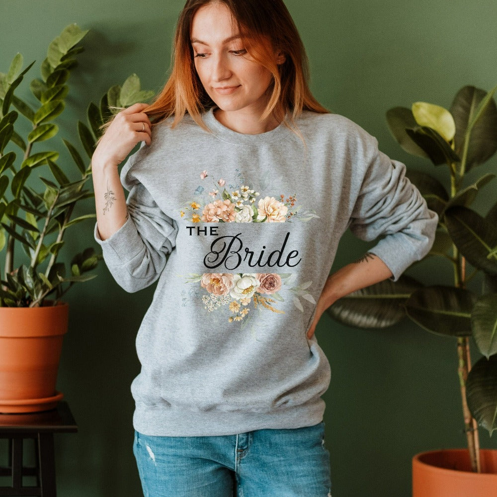 This floral bride sweatshirt is a dream and a great addition while getting ready for your wedding day. Works as an engagement announcement surprise shirt, bachelorette party outfit, gift from bridesmaid or maid of honor, rehearsal night dinner outfit and errand top for your wedding planning activities. So, if you have a soon to be bride, future Mrs. friend, or future daughter-in-law, this sweatshirt is a great gift idea for her.