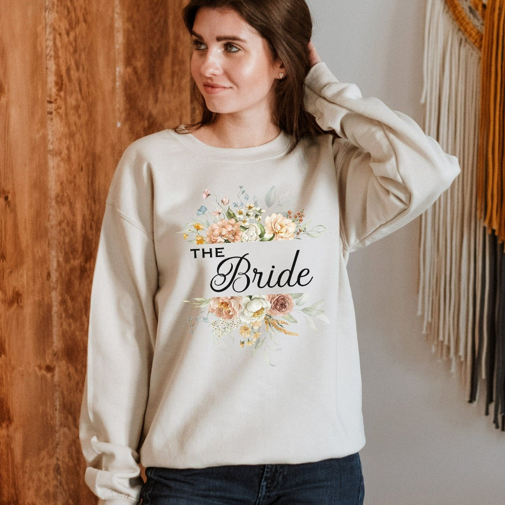 This floral bride sweatshirt is a dream and a great addition while getting ready for your wedding day. Works as an engagement announcement surprise shirt, bachelorette party outfit, gift from bridesmaid or maid of honor, rehearsal night dinner outfit and errand top for your wedding planning activities. So, if you have a soon to be bride, future Mrs. friend, or future daughter-in-law, this sweatshirt is a great gift idea for her.