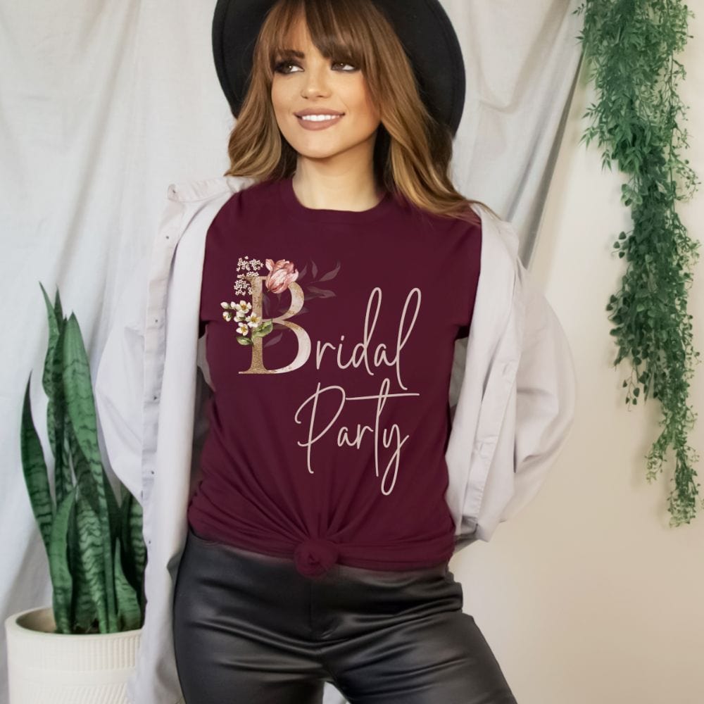 Floral bridal party shirt for maid of honor, bride team, bridesmaids, mother of the bride or groom and wedding party. Great idea for engagement announcement, bachelorette party, bridesmaid proposal box gift idea, rehearsal dinner, and after wedding parties. This cute getting ready casual tee is a perfect addition for the bride's crew, team or squad.