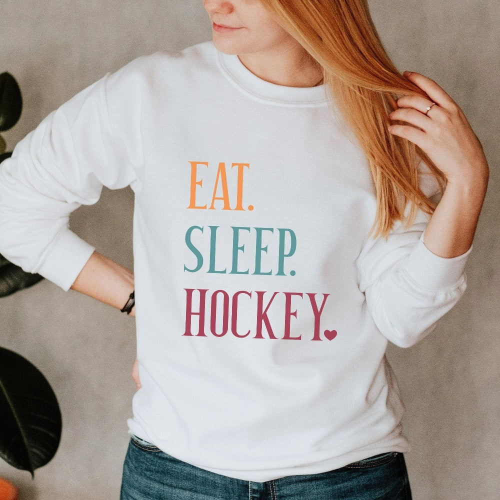 Eat, Sleep, Hockey sweatshirt. It's always sports season depending on how you play. This playful hockey gift idea for your favorite athlete or soccer mom is bright and cheerful. Great for cheering on your team, getting ready for practice, heading out for a match and being the number one fan you have always been. Perfect hockey mom or dad outfit.
