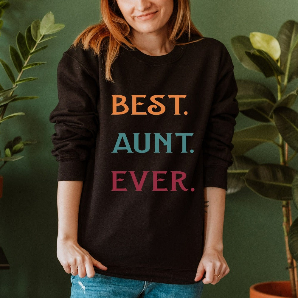 Celebrate the best Cool Aunt ever with this colorful auntie sweatshirt. Whether it's for a family reunion, weekend visit, birthday or Christmas holidays, this adorable top is a thoughtful gift idea for your aunt. Makes a great memorable present from niece or nephew on her special day. This cute uplifting outfit for aunty is a great idea for a promoted to aunt pregnancy reveal or new baby announcement surprise for your sister, family, sibling or best friend as the newest favorite funtie tia!
