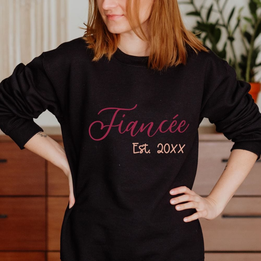 Fiancé and fiancée matching couples sweatshirt. Getting ready for a honeymoon vacation, family reunion cruise to celebrate your engagement? This his and hers matching outfit is always a hit. Customized with date, it is a perfect bridal party wedding gift sweatshirt for bride and groom. Also great as a welcome gift for future soon-to-be daughter-in-law or son-in-law and new Mr. and Mrs.