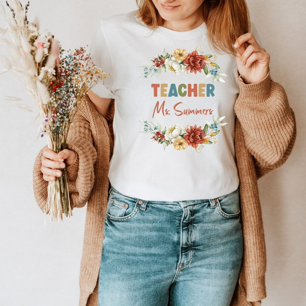 Customized floral botanical back to school teacher gift idea. This adorable shirt is for first day of school, last day, summer break or everyday appreciation present for your favorite kindergarten or grade teacher. Personalize with name with this positive outfit perfect for both classroom and field trip activities.