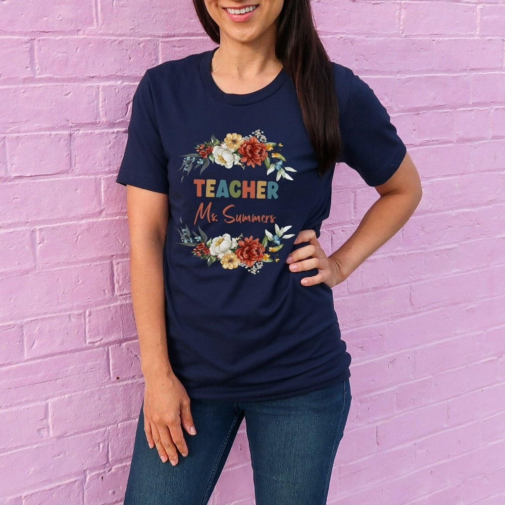Customized floral botanical back to school teacher gift idea. This adorable shirt is for first day of school, last day, summer break or everyday appreciation present for your favorite kindergarten or grade teacher. Personalize with name with this positive outfit perfect for both classroom and field trip activities.