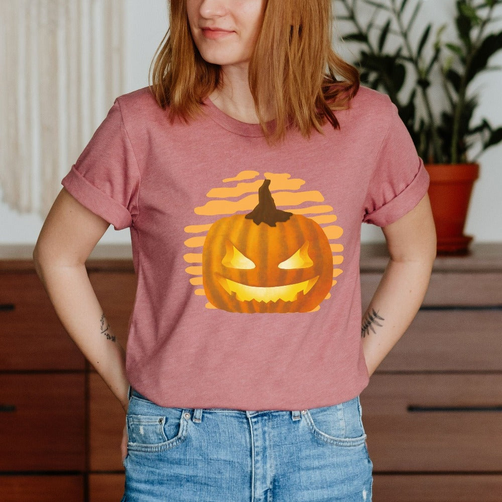 Halloween Jack-o-lantern shirt. Get ready for spooky season with this adorable cheerful t-shirt. Perfect autumn and pumpkin season outfit for fall months.
