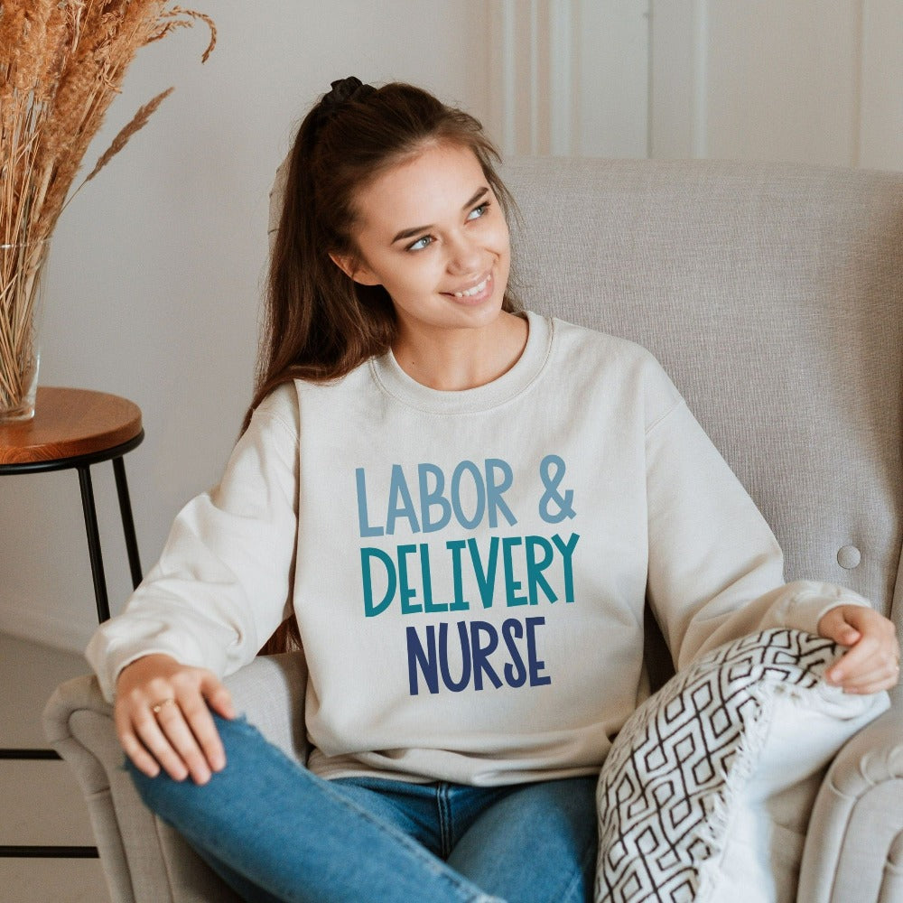 Labor and Delivery Nurse Sweatshirt. This gift idea is perfect for L&D Department Unit Nursing Graduate, New LD Ward Nurse whether as a birthday gift, graduation gift, thank you appreciation gift or Christmas holidays stocking stuffer. Perfect staff shirt for day and night hospital ward shifts.