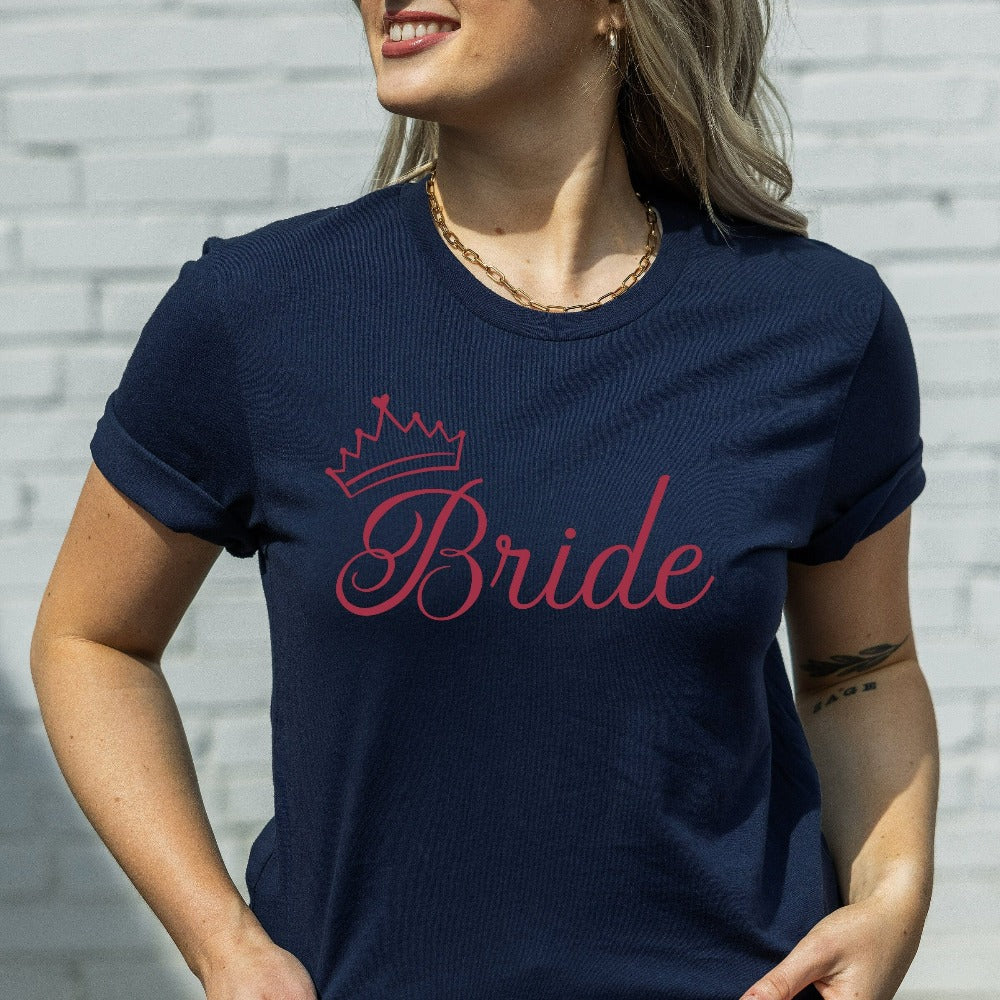 This cute bride shirt is a great addition to getting ready for your wedding day. Serves as an engagement announcement surprise shirt; bachelorette party outfit; gift from bridesmaid or maid of honor; rehearsal night dinner outfit; and errand top for your wedding planning activities. So, if you have a soon to be bride, future Mrs. friend, or future daughter-in-law, this casual tee is a great gift idea for her.
