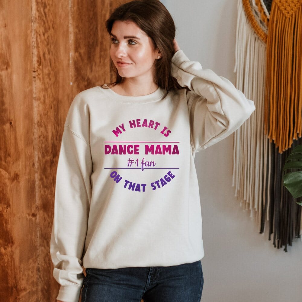 The style of our dance recital mom outfit has striking print colors and is perfectly combined to give it a more girlish, modish, chic look. Every dance mama will love wearing it all day long because of its pleasant, warm, and cozy fabric. Ballet Fan Shirt