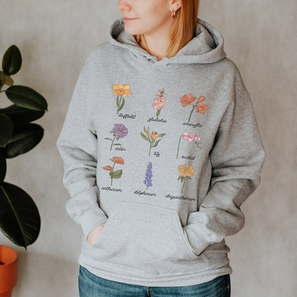 Wildflower graphic sweatshirt showing daffodil, gladiolus, amaryllis, aster, lily, orchid, anthurium, delphinium and chrysanthemum. This botanical wild flower hoodie is great for Mother's Day, birthday, Christmas holidays, gift for best friend, daughter, mom or loved one especially anyone that loves nature, flowers and adorable watercolor outfits.