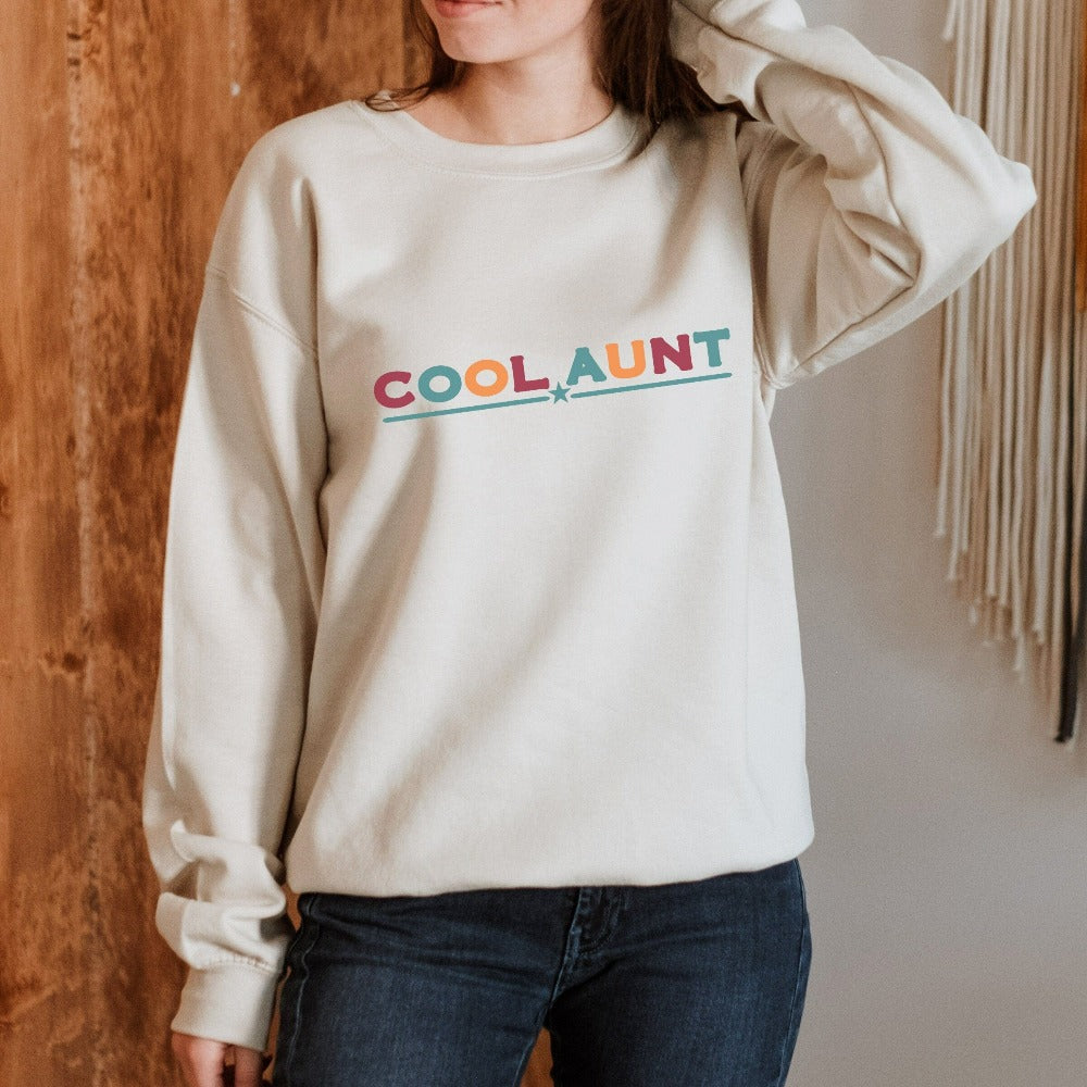 Celebrate the best Cool Aunt ever with this colorful auntie sweatshirt. Whether it's for a family reunion, weekend visit, birthday or Christmas holidays, this adorable top is a thoughtful gift idea for your aunt. Makes a great memorable present from niece or nephew on her special day. This cute uplifting outfit for aunty is a great idea for a promoted to aunt pregnancy reveal or new baby announcement surprise for your sister, family, sibling or best friend as the newest favorite funtie tia!