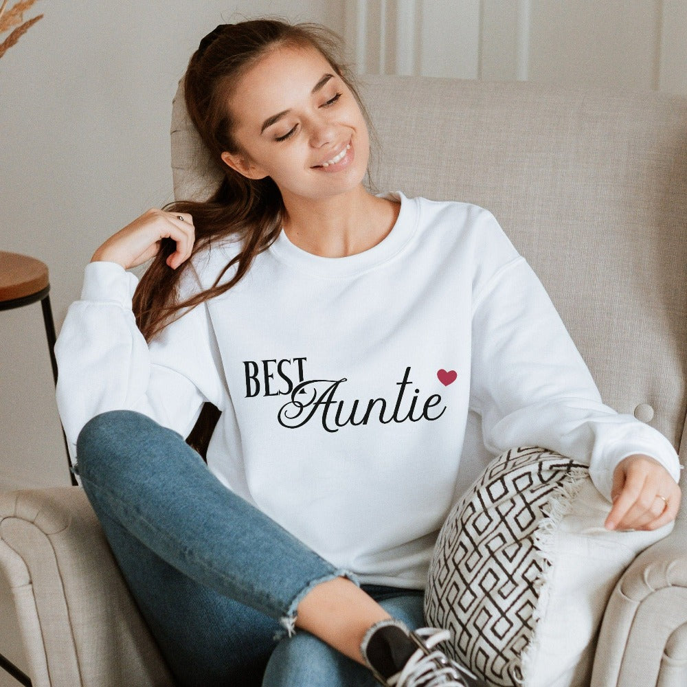 Show love and appreciation with this minimalist best auntie sweatshirt. Whether it's for a family reunion, weekend visit, birthday or Christmas holidays, this adorable top is a thoughtful gift idea for your aunt. Makes a great memorable present from niece or nephew on her special day. This cute uplifting outfit for aunty is a great idea for a pregnancy reveal or new baby announcement surprise to your sister, family, sibling or best friend as the newest favorite funtie tia!