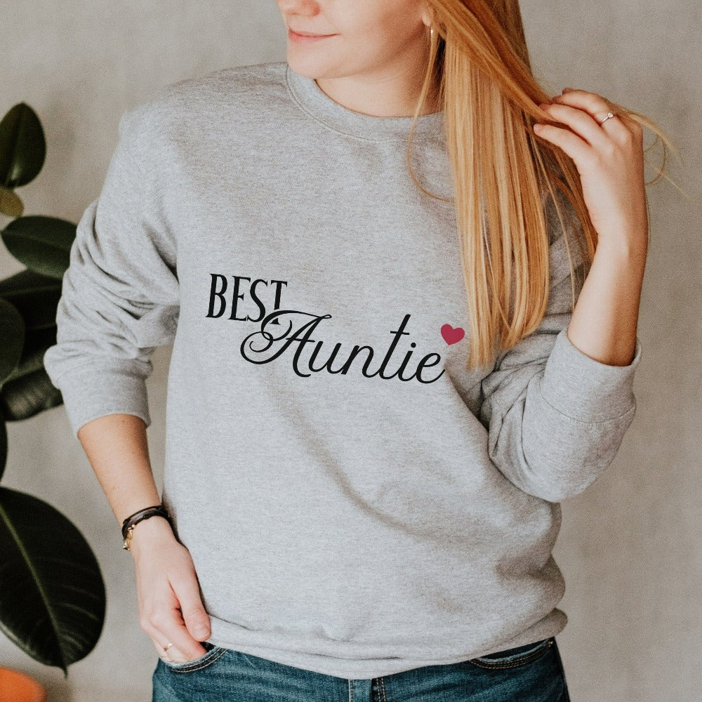 Show love and appreciation with this minimalist best auntie sweatshirt. Whether it's for a family reunion, weekend visit, birthday or Christmas holidays, this adorable top is a thoughtful gift idea for your aunt. Makes a great memorable present from niece or nephew on her special day. This cute uplifting outfit for aunty is a great idea for a pregnancy reveal or new baby announcement surprise to your sister, family, sibling or best friend as the newest favorite funtie tia!