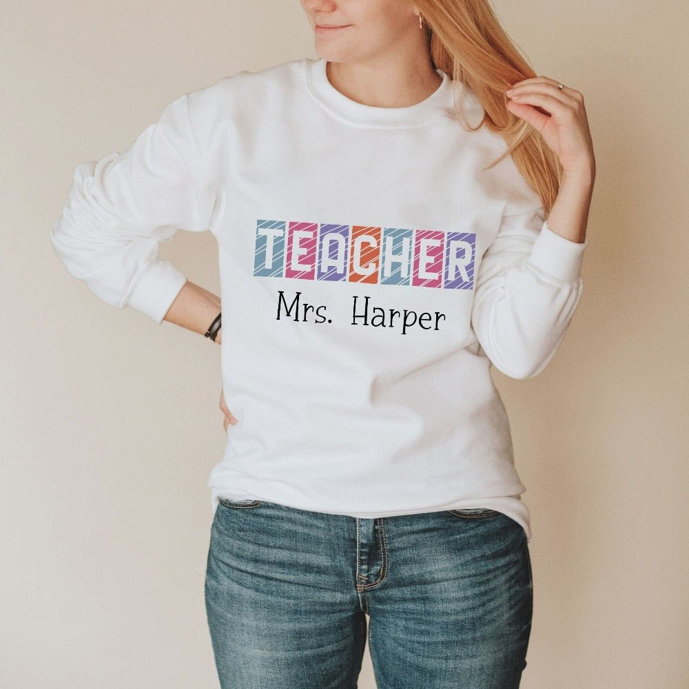 Custom name sweatshirt gift idea for teacher, trainer, instructor and homeschool mama. Show appreciation to your favorite grade teacher with this vibrant trendy shirt. Perfect for elementary, middle or high school, back to school, last day of school, summer or spring break. Great for everyday use both in and out of the classroom.