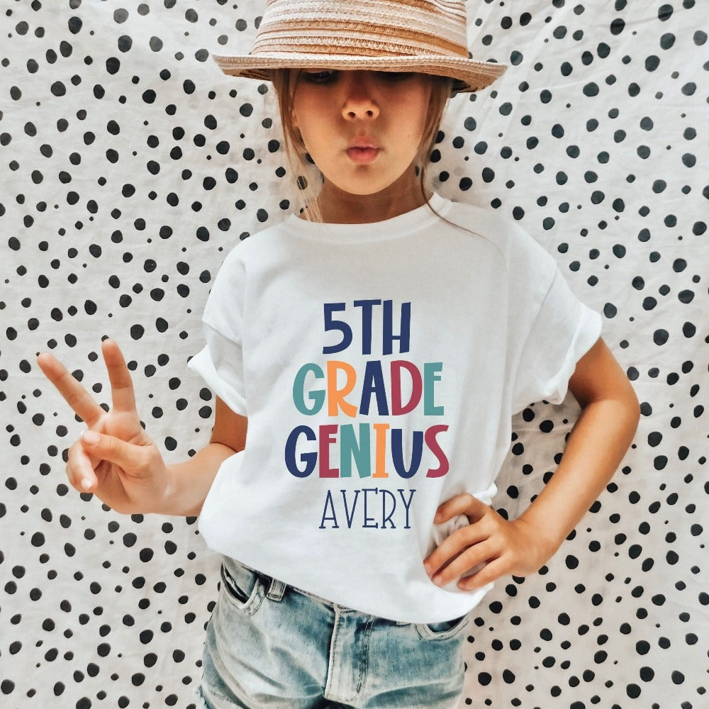 Customize this fifth grade, back to school shirt gift idea for your genius. For first day of school, school field trips, 100 days of school, graduation or a new grade. Perfect name tee outfit for everyday use in or out of classroom. 5th grade t-shirt.