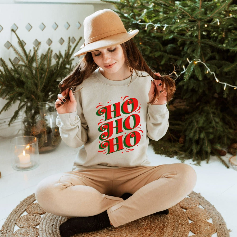Jolly, merry and bright Ho Ho Ho Christmas sweatshirt. Great matching family reunion lounge set for the holidays. Celebrate the Xmas spirit, snow days, sweater weather, lights and great friendship with this adorable festive outfit. Perfect gift idea fit for home visits, office end of year party, secret Santa, family stocking stuffers, teacher gifts and Christmas season presents.