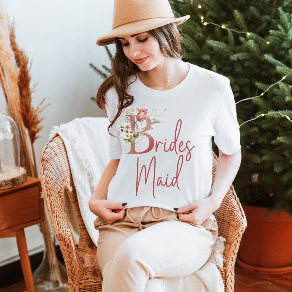 Floral bridal party shirt for bridesmaid, BFF and bestie team on your wedding. Great idea for engagement announcement, bachelorette party, bridesmaid proposal box gift idea, rehearsal dinner, and after wedding parties. This cute getting ready casual tee is a perfect addition for the bride's crew, team or squad.