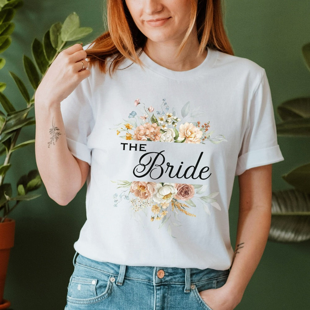 This floral bride shirt is a dream and a great addition while getting ready for your wedding day. Works as an engagement announcement surprise shirt, bachelorette party outfit, gift from bridesmaid or maid of honor, rehearsal night dinner outfit and errand top for your wedding planning activities. So, if you have a soon to be bride, future Mrs. friend, or future daughter-in-law, this cute casual tee is a great gift idea for her.