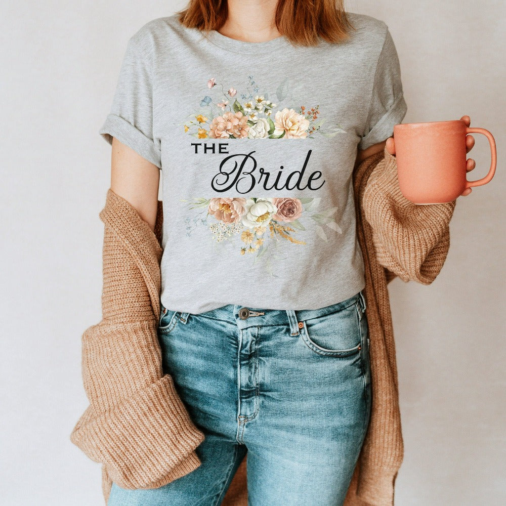 This floral bride shirt is a dream and a great addition while getting ready for your wedding day. Works as an engagement announcement surprise shirt, bachelorette party outfit, gift from bridesmaid or maid of honor, rehearsal night dinner outfit and errand top for your wedding planning activities. So, if you have a soon to be bride, future Mrs. friend, or future daughter-in-law, this cute casual tee is a great gift idea for her.