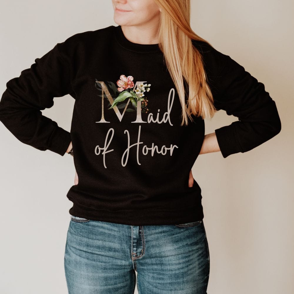 Floral maid of honor wedding party sweatshirt for matron of honor. Great idea for engagement announcement, bachelorette party, bridesmaid proposal box gift idea, rehearsal dinner, and after wedding parties. This cute getting ready outfit is a perfect addition for the bride's crew, team or squad.
