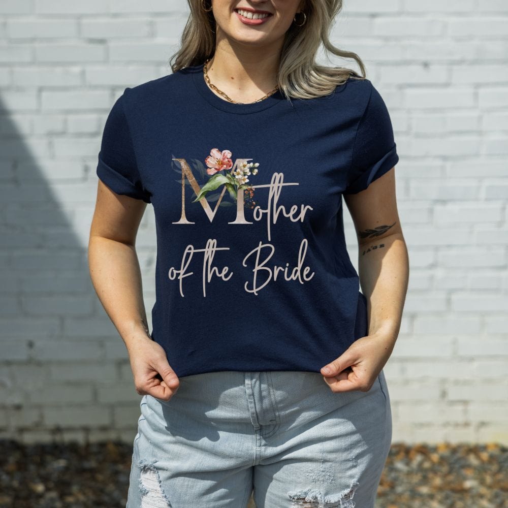 Floral mother of the bride wedding party shirt for mom. Great idea for engagement announcement, rehearsal dinner, and after wedding parties. This cute getting ready apparel is a perfect addition to the bride's crew, team or squad.