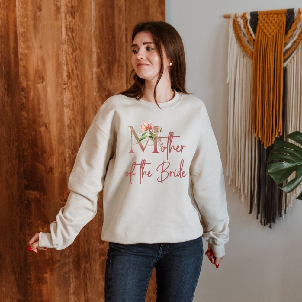 Floral mother of the bride wedding party sweatshirt for mom. Great idea for engagement announcement, rehearsal dinner, and after wedding parties. This cute getting ready apparel is a perfect addition to the bride's crew, team or squad.