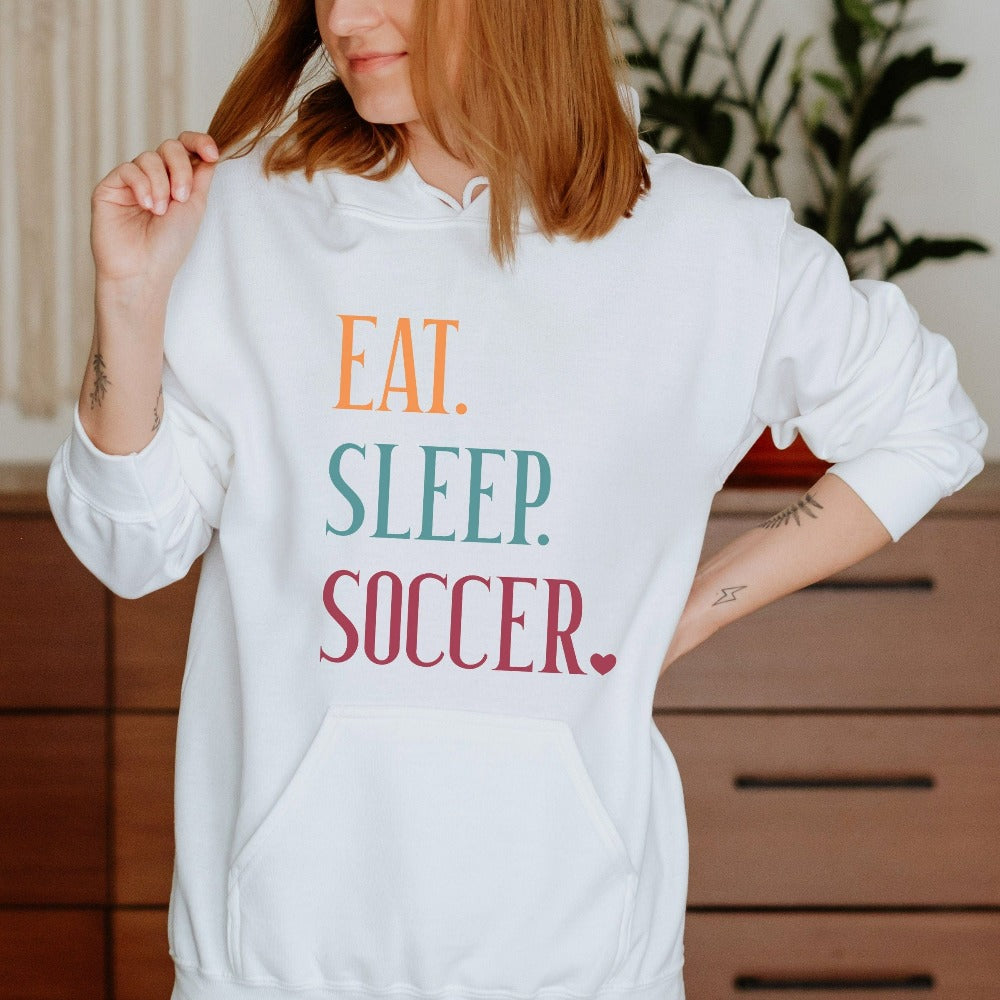 Eat, Sleep, Soccer sweatshirt. It's always sports season depending on how you play. This playful soccer gift idea for your favorite athlete or soccer mom is bright and cheerful. Great for cheering on your team, getting ready for practice, heading out for a match and being the number one fan you have always been. Perfect soccer mom or dad outfit.