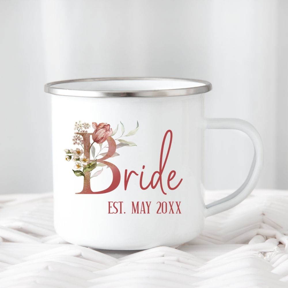 Customizable floral bride coffee mug souvenir for fiancée, wife, spouse, BFF or bestie on your wedding or anniversary. Great idea for engagement announcement, bachelorette party, bridesmaid gift idea, rehearsal dinner tea cup, and after wedding party gift. This cute getting ready present is a perfect idea for soon-to-be daughter-in-law, future Mrs. bride or as a honeymoon vacation souvenir. Personalize with date for a special touch.