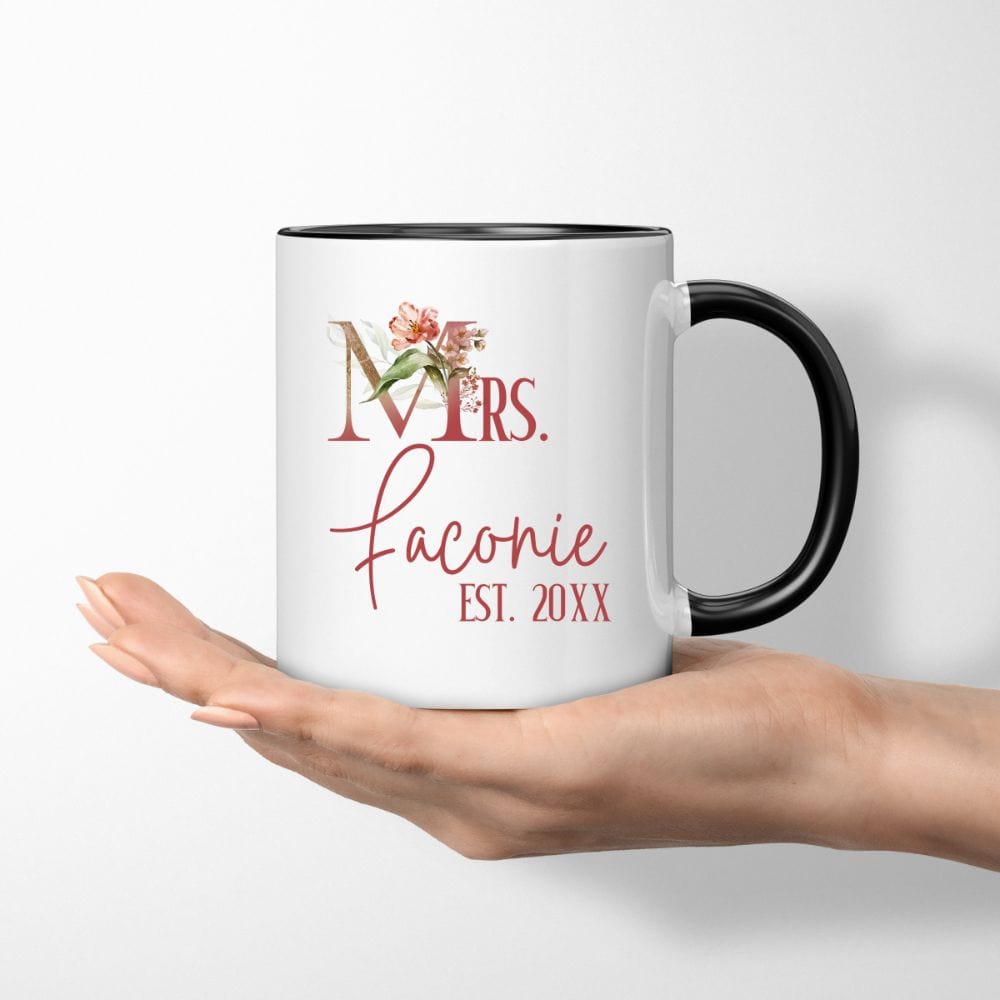 Customizable floral Mrs coffee mug souvenir for fiancée, wife, spouse, BFF or bestie on your wedding or anniversary. Great idea for engagement announcement, bachelorette party, bridesmaid gift idea, rehearsal dinner tea cup, and after wedding party gift. This cute getting ready present is a perfect idea for soon-to-be daughter-in-law, future Mrs. bride or as a honeymoon vacation souvenir. Personalize with name and date for a special touch.