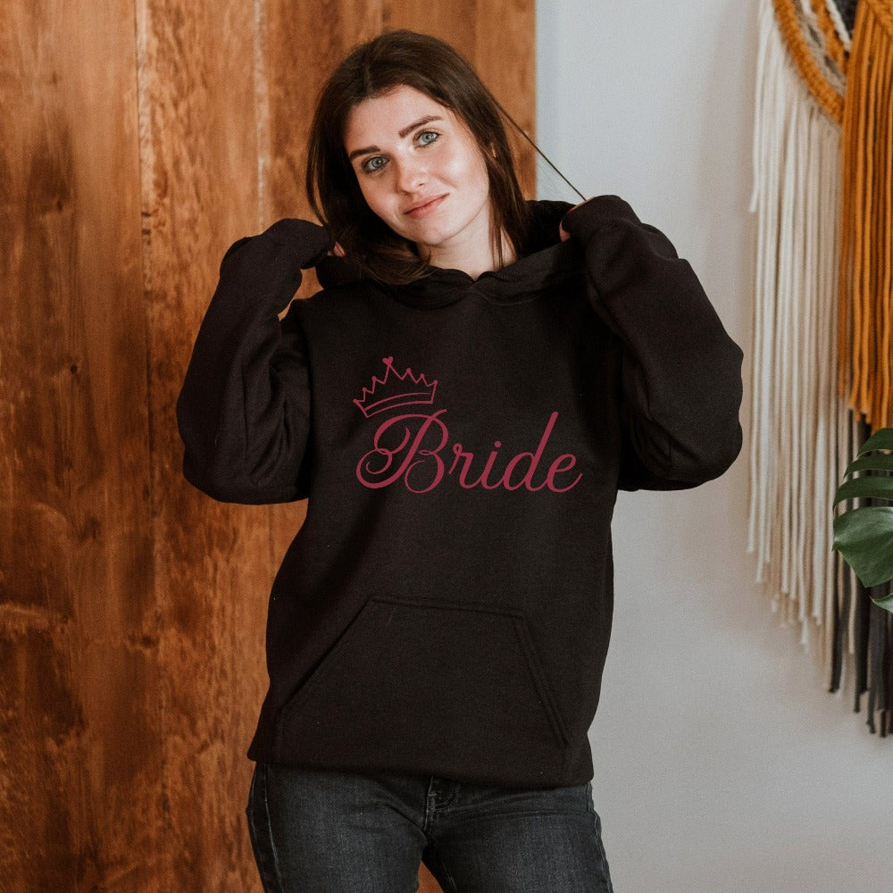 This cute bride sweatshirt is a great addition to getting ready for your wedding day. Serves as an engagement announcement surprise shirt; bachelorette party outfit; gift from bridesmaid or maid of honor; rehearsal night dinner outfit; and errand top for your wedding planning activities. So, if you have a soon to be bride, future Mrs. friend, or future daughter-in-law, this comfy hoodie is a great gift idea for her.