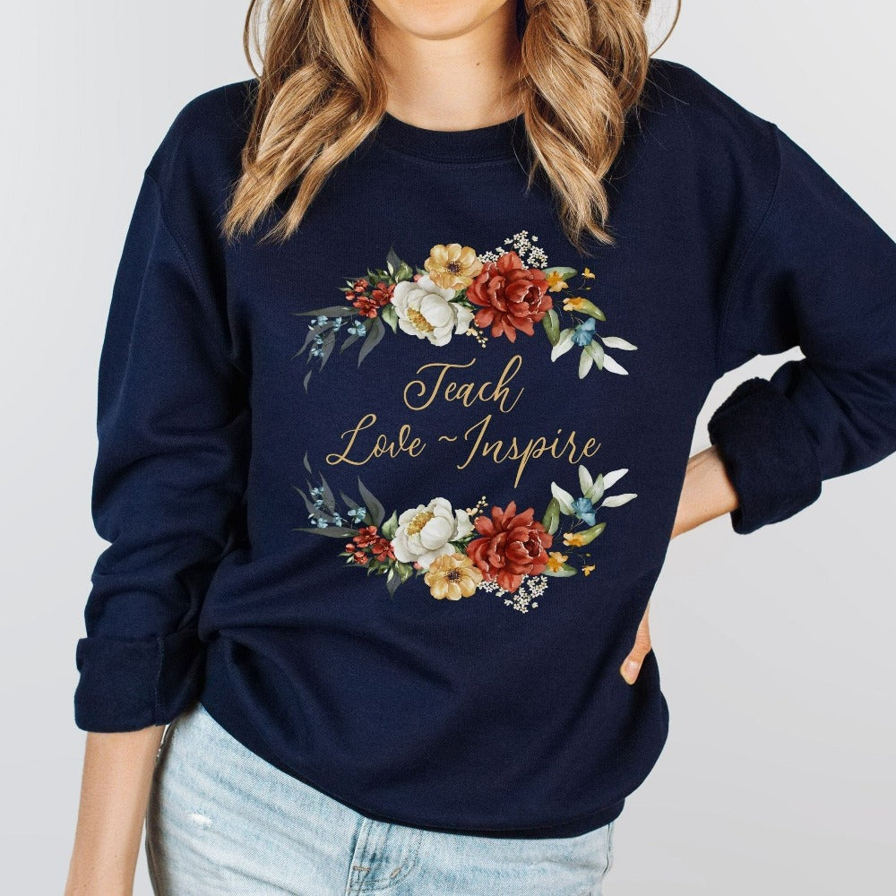 Floral botanical back to school teacher gift idea. This adorable sweatshirt is for first day of school, last day, summer break or everyday appreciation present for your favorite kindergarten or grade teacher. Teach, Love, Inspire, Learn and Motivate in this positive outfit perfect for both classroom and field trip activities.