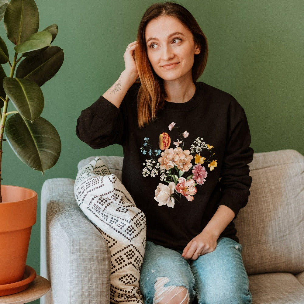 Bright, beautiful, simple and elegant. This adorable boho botanical floral sweatshirt is a favorite. With wild flowers and cottage core vibes, it is perfect for any nature lover, plant lover or really anyone that appreciates the outdoors. The watercolor flower arrangement in pastel colors makes this graphic top unique and beautiful. Perfect gift idea for birthday, Christmas holiday, Mother's Day, Thanksgiving or anniversary.