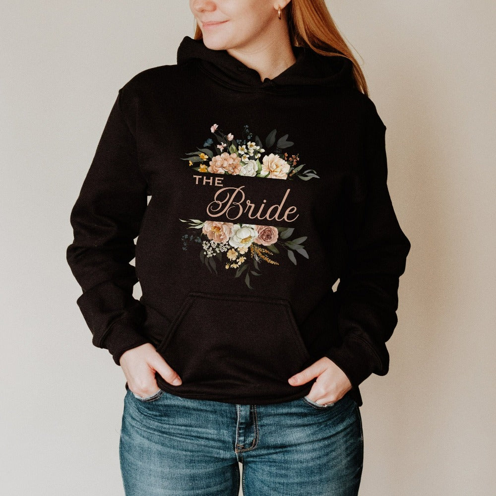 This floral bride sweatshirt is a dream and a great addition while getting ready for your wedding day. Works as an engagement announcement surprise shirt, bachelorette party outfit, gift from bridesmaid or maid of honor, rehearsal night dinner outfit and errand top for your wedding planning activities. So, if you have a soon to be bride, future Mrs. friend, or future daughter-in-law, this cozy hoodie is a great gift idea for her.