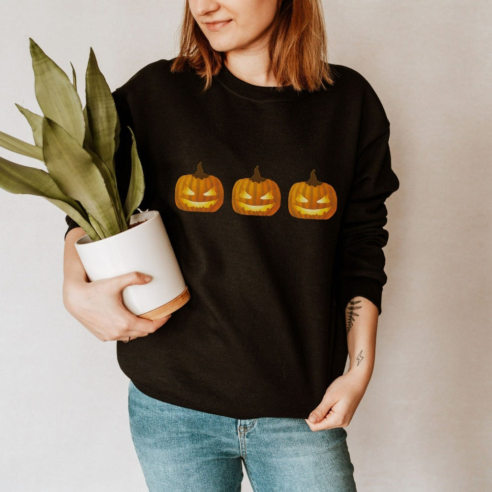 Halloween Jack-o-lantern Sweatshirt. Get ready for spooky season with this adorable cheerful shirt. Perfect autumn and pumpkin season outfit for fall months.